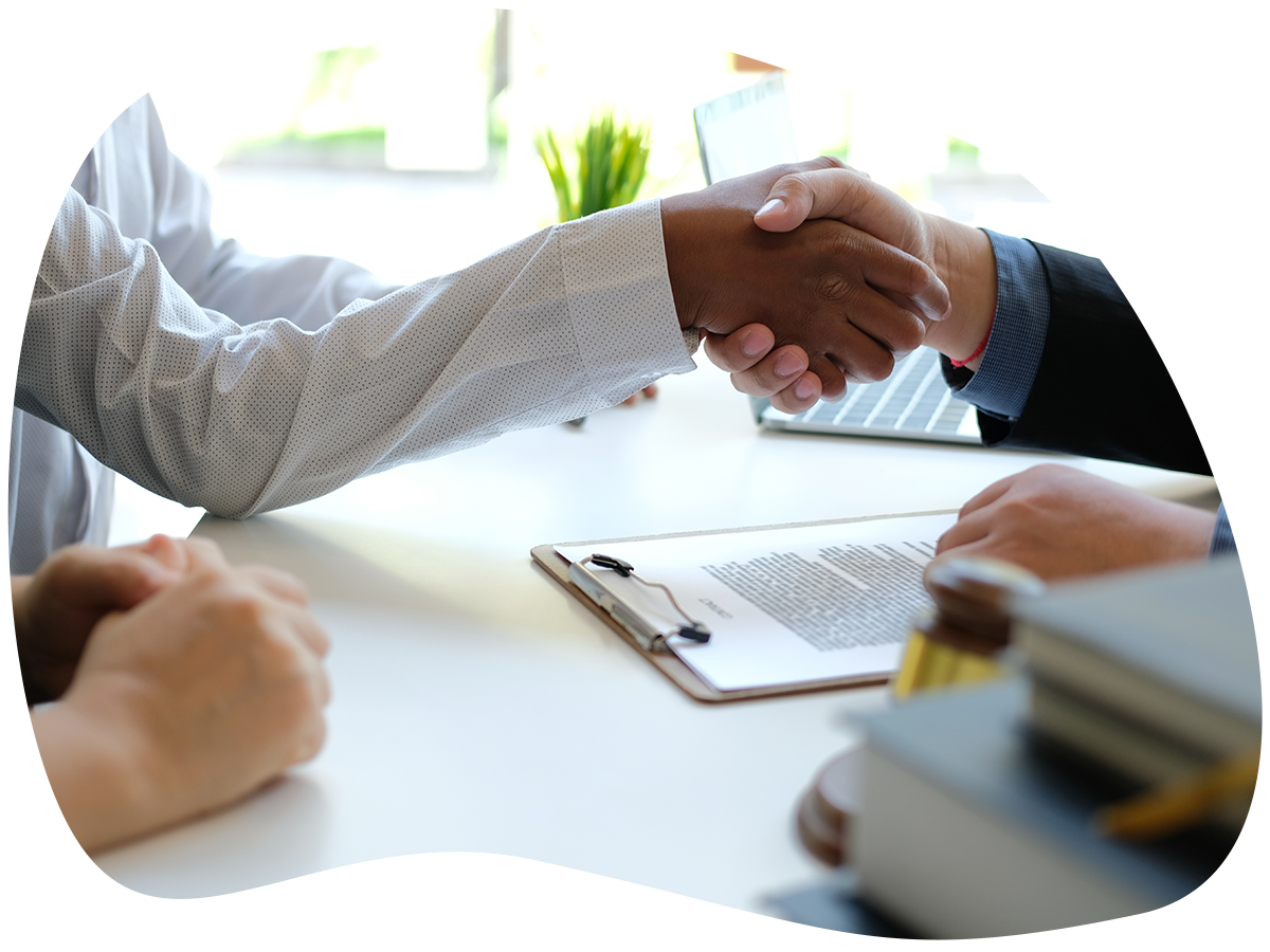 Image of a home buyer shaking hands with their mortgage broker.